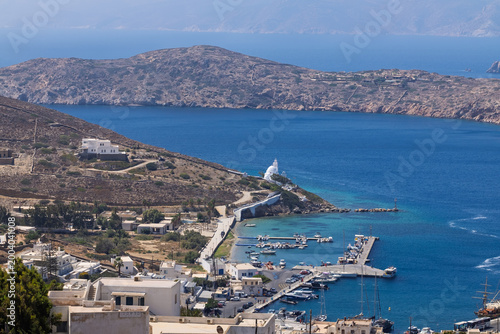 Panoramic view of the beautiful picturesque port of Ios Greece and the island of Sikinos in the background