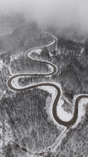 Winding and dangerous mountain road in winter.