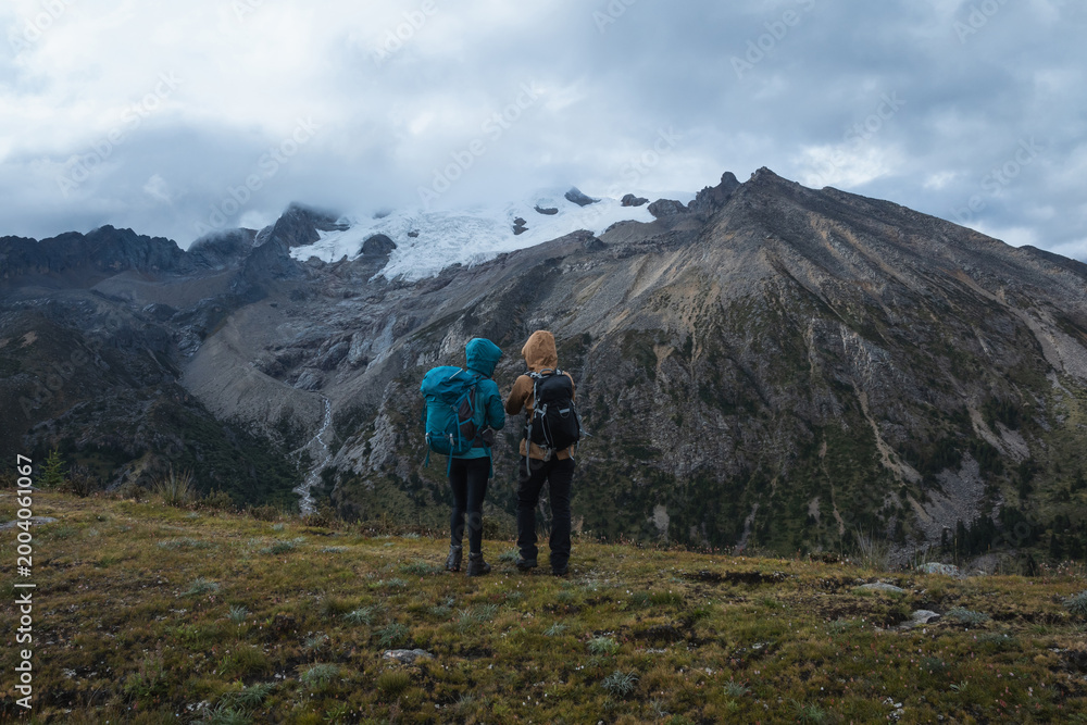 Fototapeta premium Backpackers hiking on high altitude mountain top