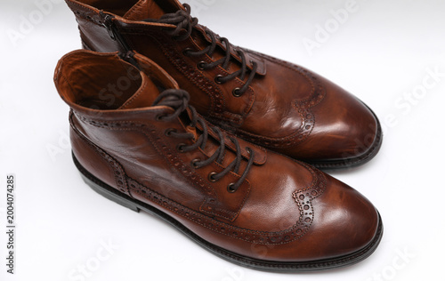 Foto Brown leather brogue boots on a white background
