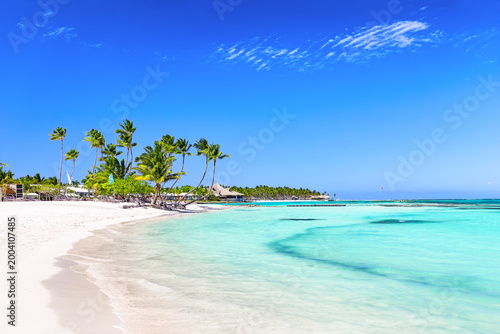 Beautiful white sand beach and turquoise water of Caribbean sea in Cap Cana, Dominican Republic. Summer beach holiday background