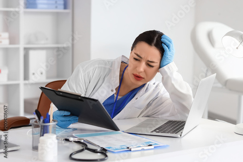 Female doctor with clipboar...