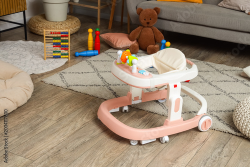 Baby walker with toys in st...