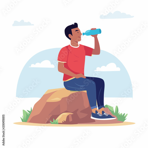 Man drinking water from bottle while sitting on rock outdoors