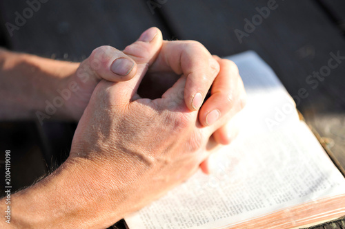 Praying Hands Open Bible Dramatic Natural Light — Faith Spirituality Devotion Christianity Close Up 
Portrait Norway