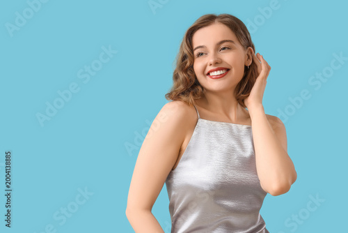 Smiling young woman with bo...