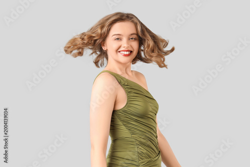 Smiling young woman with bo...