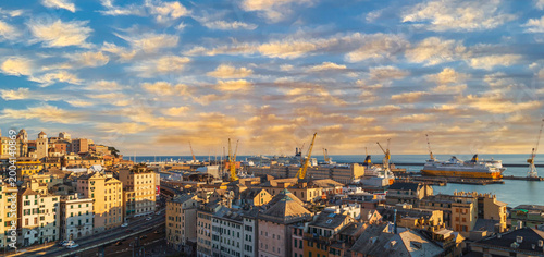 GENOA, ITALY - MARCH 20, 2021: Panoramic view of port of Genoa with colorful houses on italian coastline.