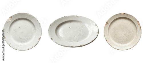 Obraz na plátně Vintage ceramic plates in rustic white tones, worn chipped edges and speckled pa