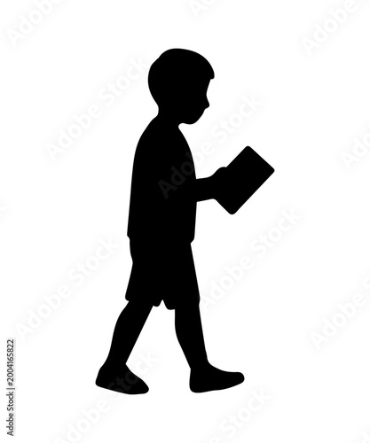 Little boy school student walking carrying school book, an education and childhood concept