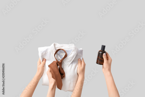 Female hands with men's tie...