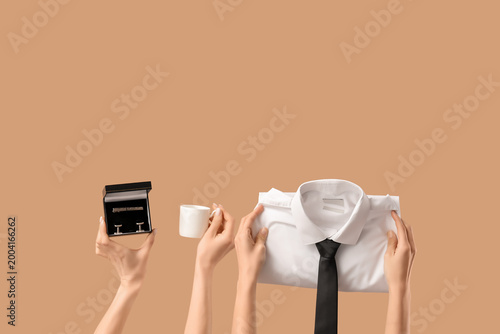 Young women holding cup of ...