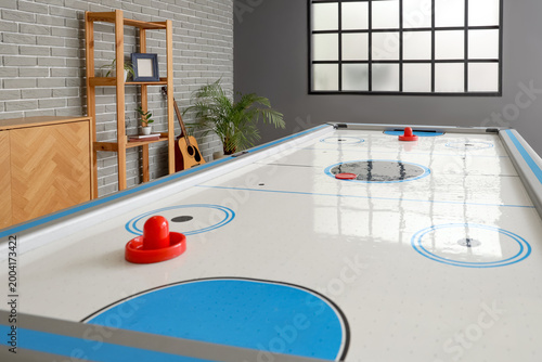 Modern air hockey in room
