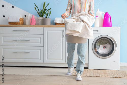 Woman with basket of clothe...