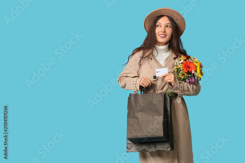 Young Asian woman with shop...