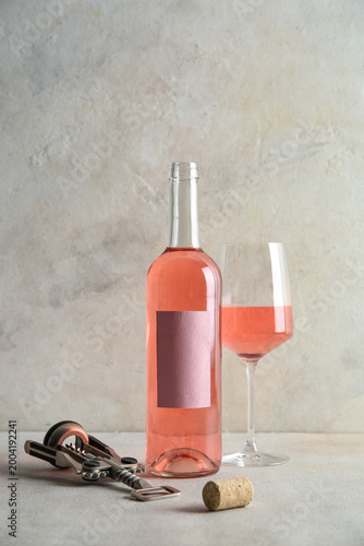 Glass, bottle of pink wine ...