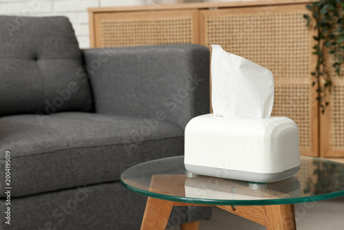 Tissue in ceramic holder on...