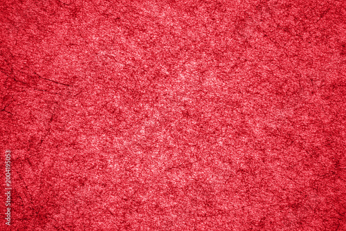 Photos Bright red textured background with deep color and subtle patterns visible acros