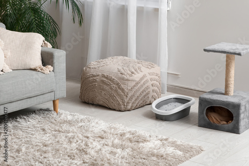 Cat litter box near scratch...