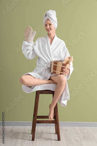 Young woman in bathrobe wit...
