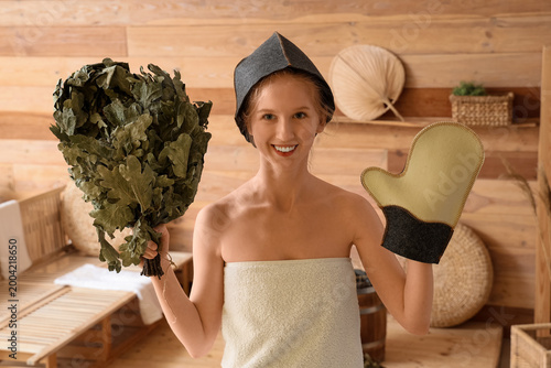 Young woman with whisk and ...