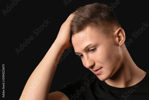 Young man with stylish hair...