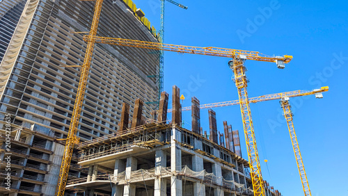 Konstfotografi Tower cranes and modern structures rising during a large scale construction proj
