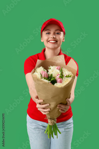 Female courier with bouquet...