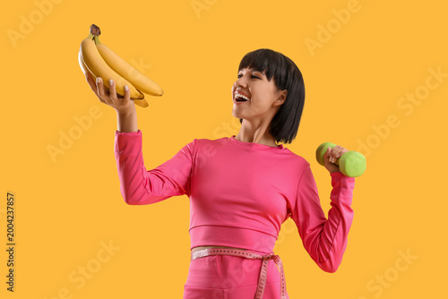 Sporty young woman with ban...