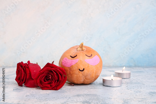 Pumpkin with drawn face, un...
