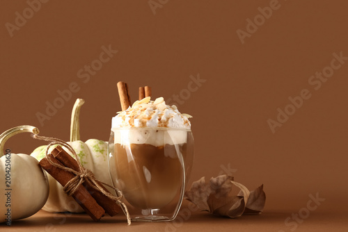 Glass of tasty pumpkin latt...