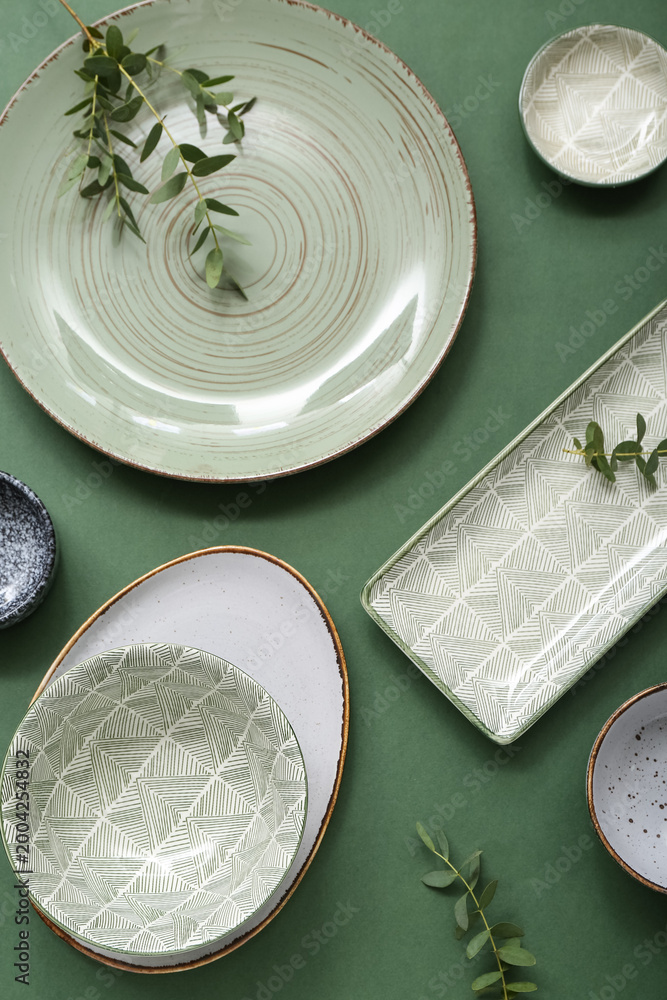 Fototapeta premium Beautiful table setting on green background