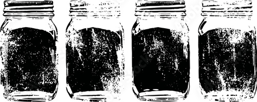 Four vintage mason jars with lids, rustic kitchen canning containers in a row