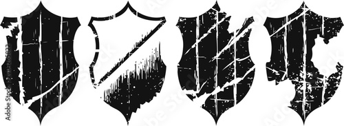 Set of four distressed vintage shield emblems with various diagonal stripes and scratch textures