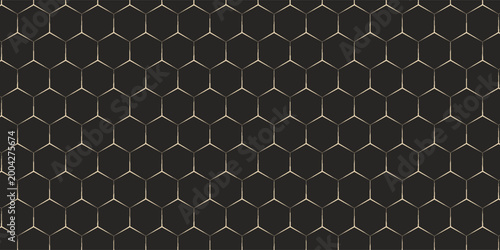 Abstract background of hexagonal honeycombs.  Vintage pattern in a golden shade on a dark background. An elegant pattern for your design.  It can be used in web design, packaging, printing, textiles,