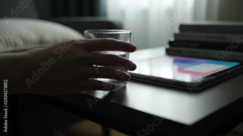 Glass of water on coffee table.