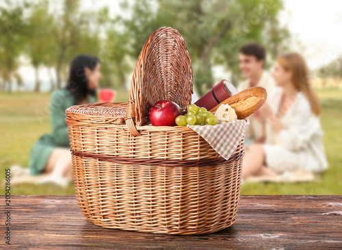Wicker picnic basket with t...