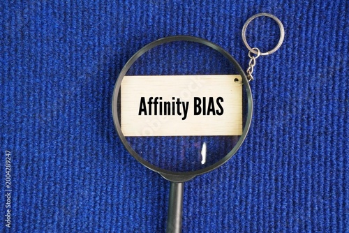 Принти на полотні A magnifying glass and a wooden tag with the word Affinity bias