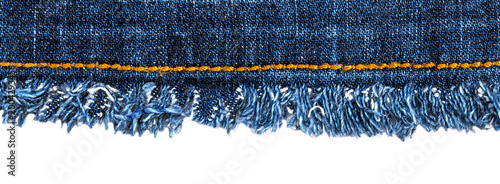 Obraz na plátně Denim fabric with frayed edges and yellow stitching displayed on a white backgro