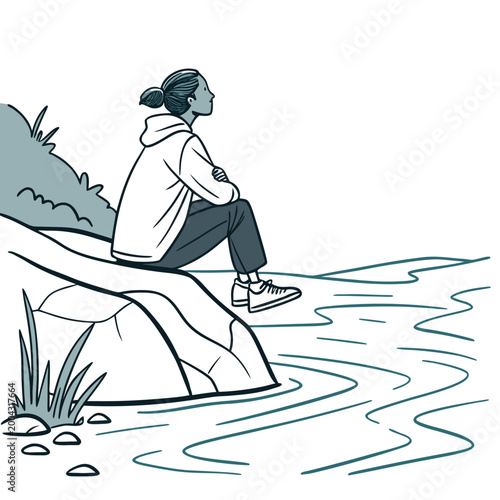 A woman sits on a rock by the water looking out at the horizon in contemplation