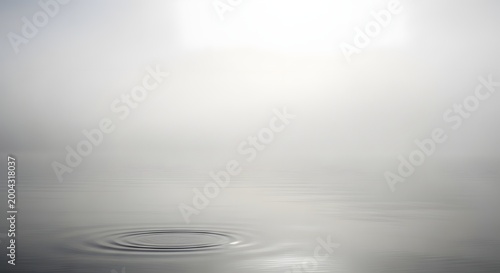 Gentle water ripple effect with soft lighting creating a serene and tranquil atmosphere, perfect for relaxation or meditation