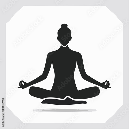 Silhouette of a person meditating in lotus pose