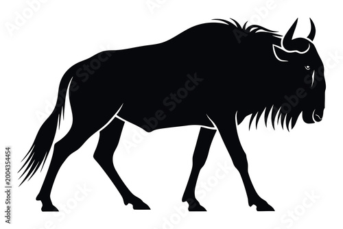 Fotografija Wildebeest silhouette a striking black profile of african wildlife in motion