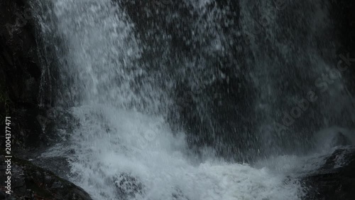 Close up of flowing waterfall stream, clear fresh natural water and peaceful wild nature landscape
