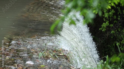 Close up of flowing waterfall stream, clear fresh natural water and peaceful wild nature landscape
