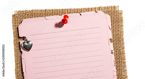 Pink Lined Paper Note with Heart Charm and Burlap Background
