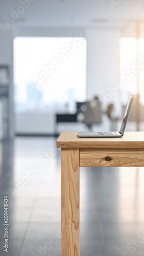 Laptop computer on wooden desk in blurred modern office interior, remote work and business communication, professional workspace, productivity, digitalization