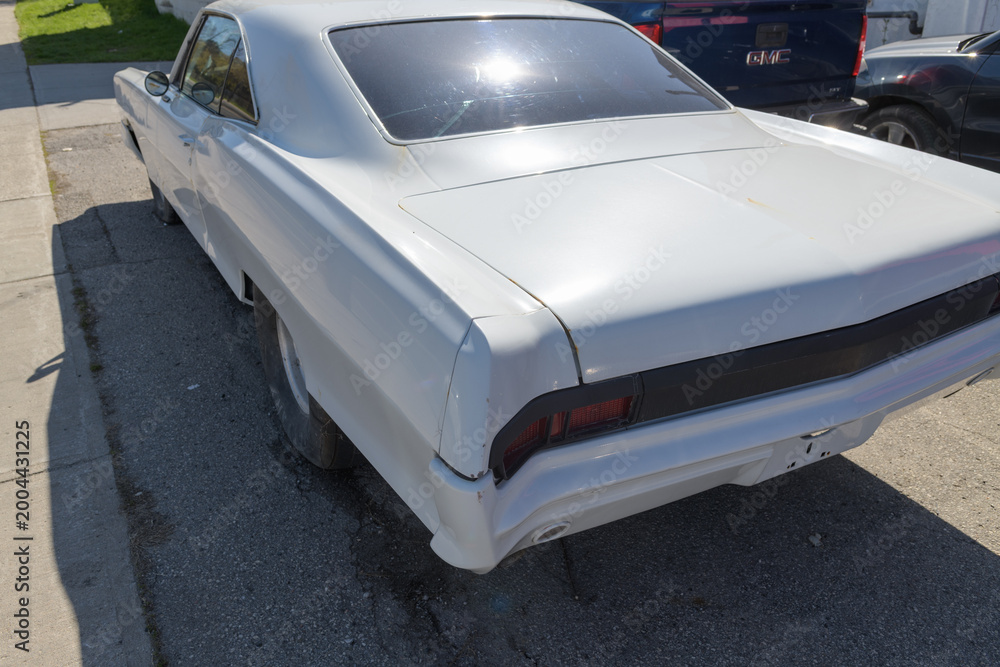 Fototapeta premium rear of a circa 1970 Chevrolet Nova being restored in Toronto