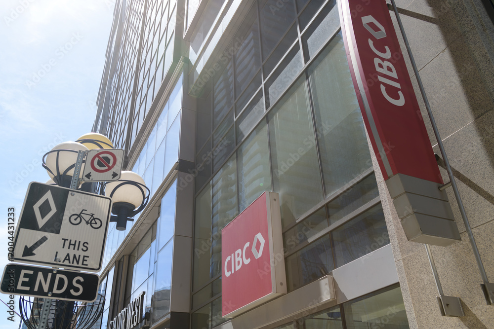 Obraz premium exterior building and sign of CIBC bank branch at 2 Bloor St W, Toronto