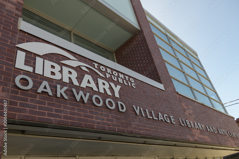 Fototapeta premium close-up exterior building and sign of Toronto Public Library - Oakwood Village Library and Arts Centre, 341 Oakwood Av
